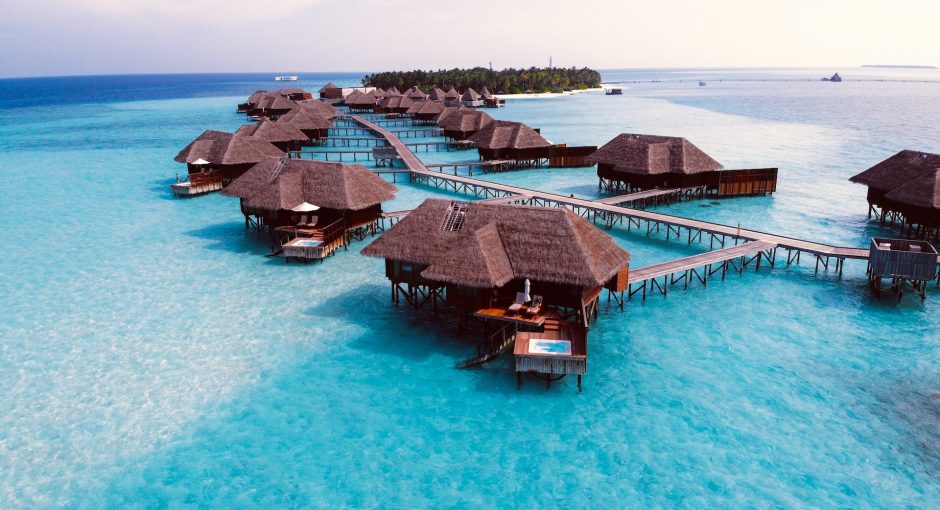 brown wooden cottage on blue body water